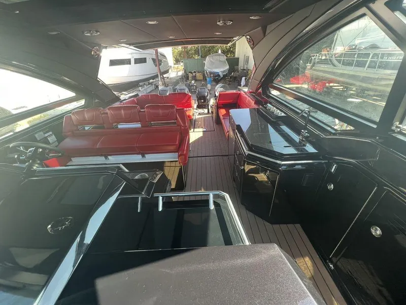 Slide: The Image of 2022 Formula 400 Super Sport Crossover interior with red seating and sleek black surfaces. - 36