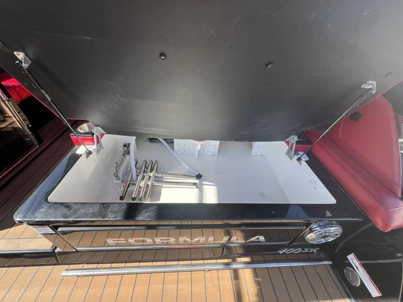 Slide: The Image of 2022 Formula 400 Super Sport Crossover storage compartment with open lid and visible interior. - 41