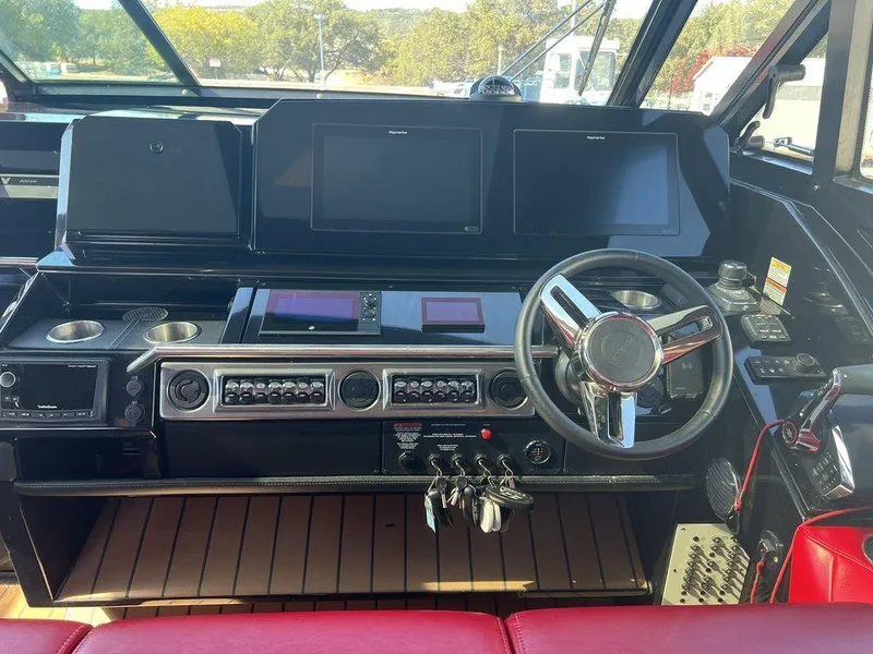 Slide: The Image of 2022 Formula 400 Super Sport Crossover helm with advanced navigation displays and controls. - 42