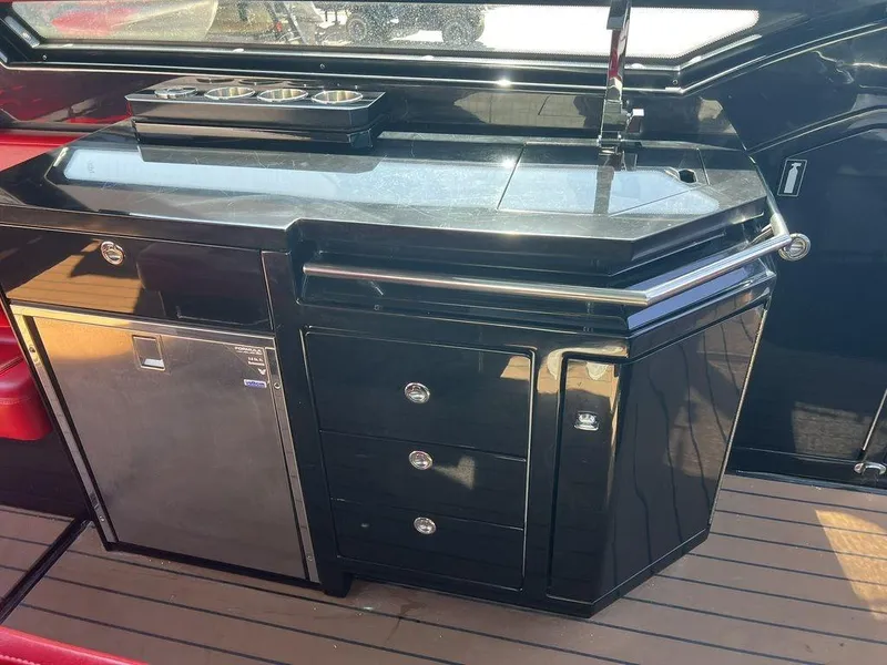 Slide: The Image of 2022 Formula 400 Super Sport Crossover yacht kitchen with sleek black cabinetry and stainless steel appliances. - 43