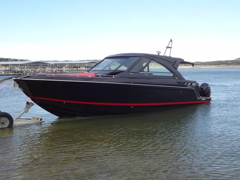 Slide: The Image of 2022 Formula 400 Super Sport Crossover boat in water, black with red accents. - 9