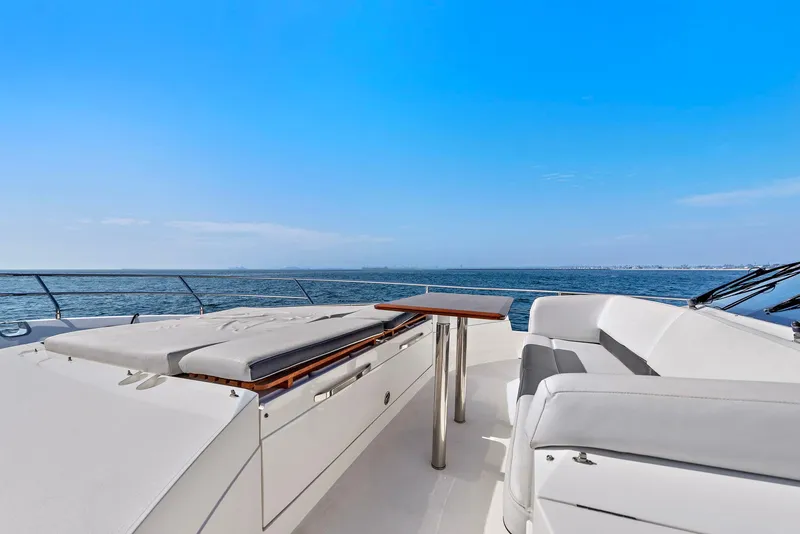 Slide: The Image of Luxurious bedroom interior of 2015 Princess 72 Motor Yacht with elegant wood paneling. - 26