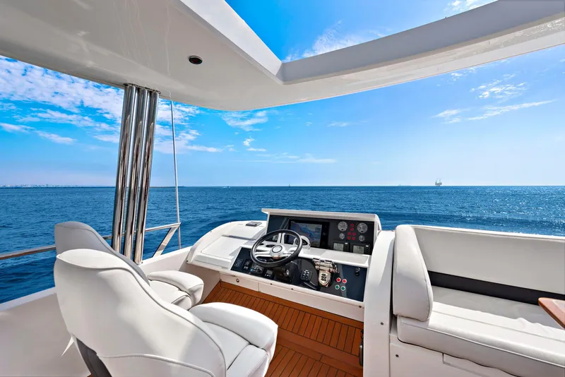 Slide: The Image of Luxurious 2015 Princess 72 Motor Yacht deck with seating and ocean view. - 39
