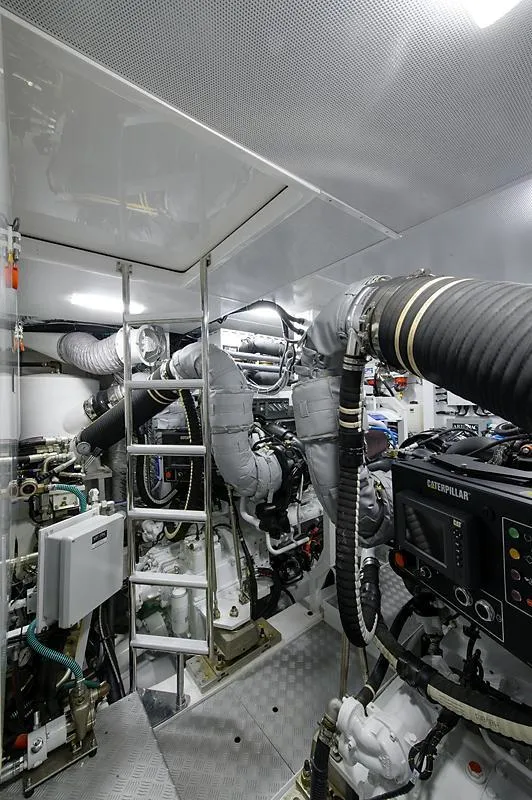 Slide: The Image of 2015 Princess 72 Motor Yacht on open water, rear view, with tender boat attached. - 44