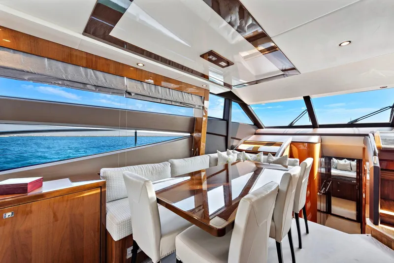 Slide: The Image of Luxurious 2015 Princess 72 Motor Yacht deck with seating, ocean view, and American flag. - 5
