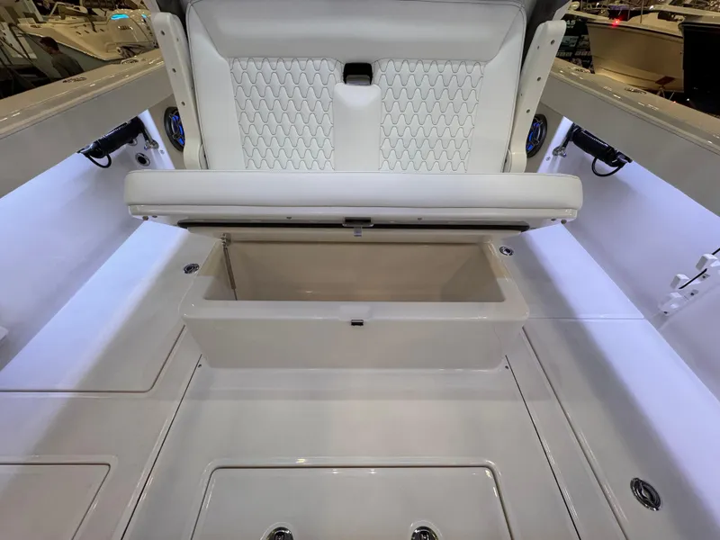 Slide: The Image of 2025 Solace 32 CS boat interior with open storage compartment. - 11