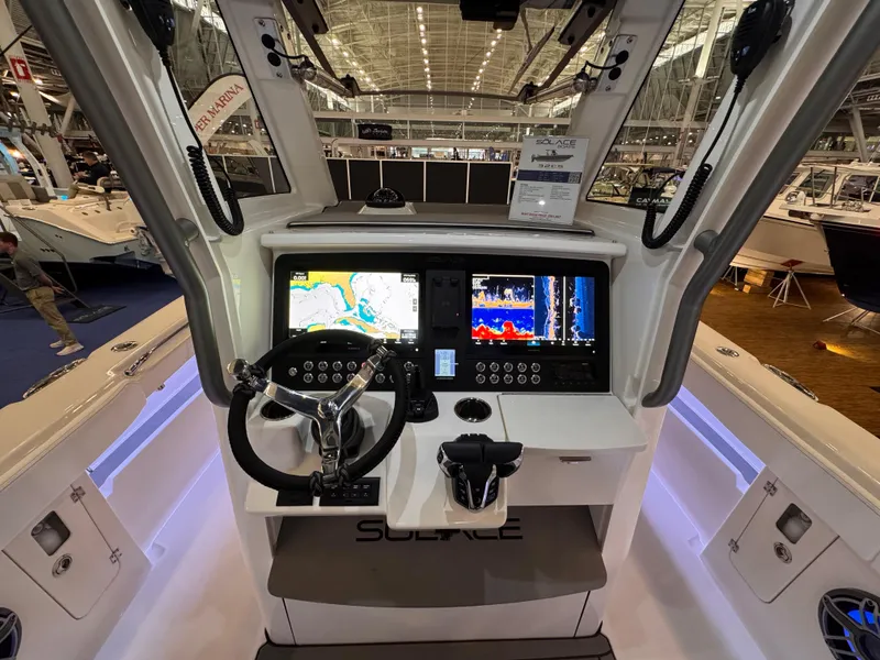 Slide: The Image of 2025 Solace 32 CS boat cockpit with advanced navigation system and controls. - 13