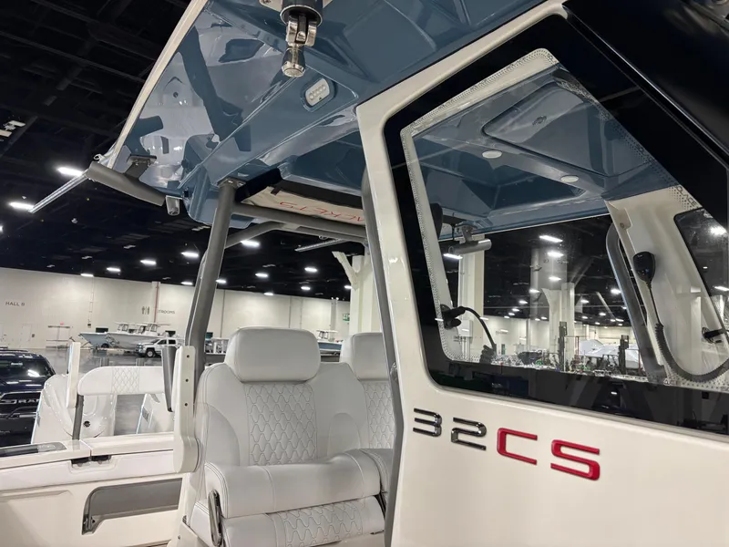Slide: The Image of 2025 Solace 32 CS boat interior with modern seating and sleek design. - 6