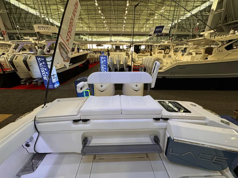 Slide: The Image of 2025 Solace 32 CS boat displayed at an indoor boat show. - 8