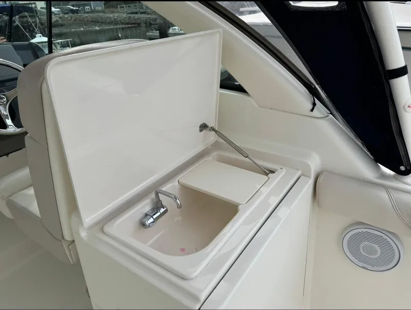 Slide: The Image of 2014 Pursuit DC 265 Dual Console boat sink and faucet detail. - 11