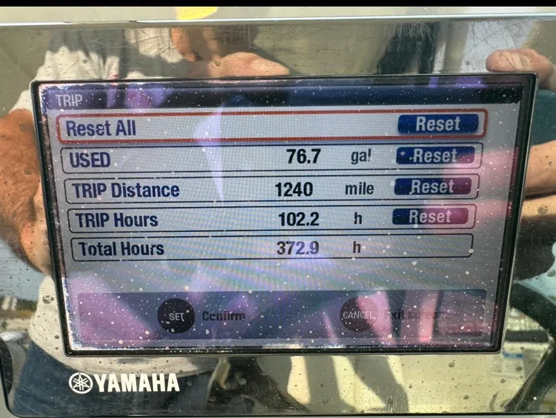 Slide: The Image of Yamaha display showing trip data: 76.7 gallons used, 1240 miles, 102.2 trip hours. - 15