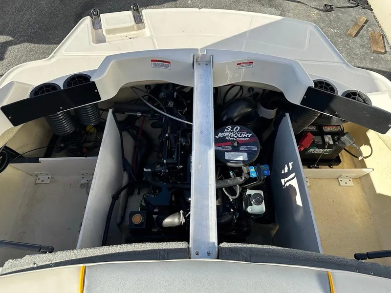 Slide: The Image of Engine compartment of a 2008 Sea Ray 185 Sport boat, featuring a 3.0 MerCruiser engine. - 11