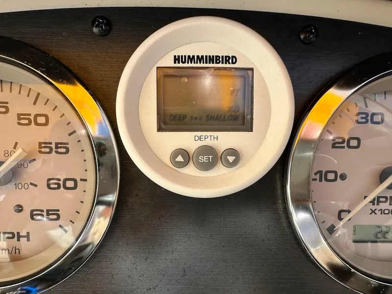 Slide: The Image of Dashboard of a 2008 Sea Ray 185 Sport with Humminbird depth gauge. - 12