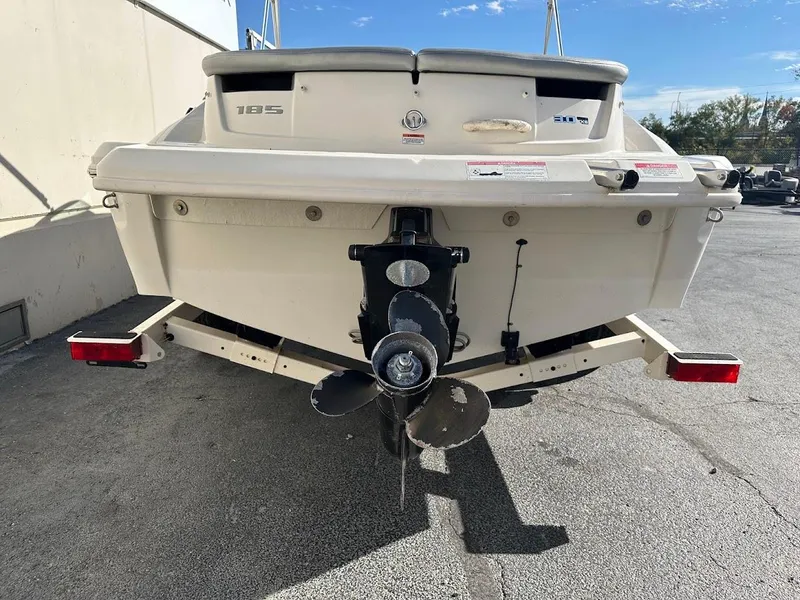 Slide: The Image of 2008 Sea Ray 185 Sport boat rear view, showcasing propeller and hull design. - 4