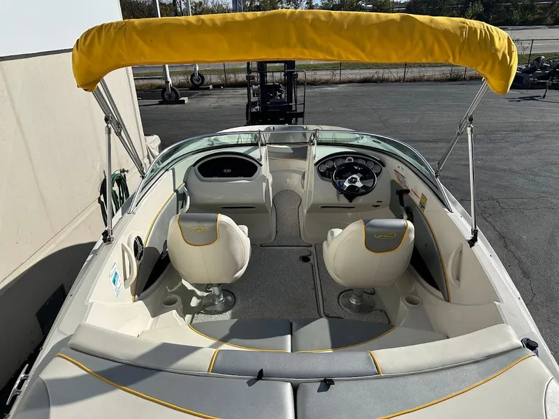 Slide: The Image of 2008 Sea Ray 185 Sport boat with yellow canopy and dual seating. - 6