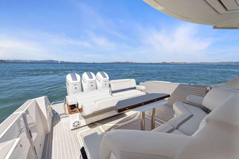 Slide: The Image of Luxurious 2024 Tiara Yachts 48 LS with spacious deck and triple outboard engines. - 14