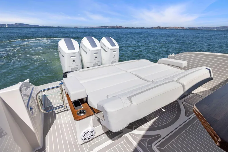 Slide: The Image of 2024 Tiara Yachts 48 LS luxury yacht with spacious deck and triple outboard engines. - 16