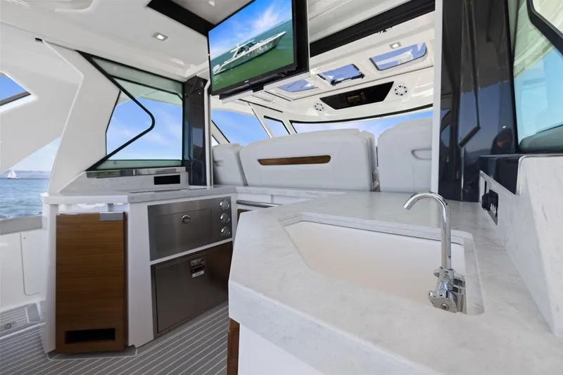 Slide: The Image of Luxurious interior of 2024 Tiara Yachts 48 LS with modern amenities and sleek design. - 24