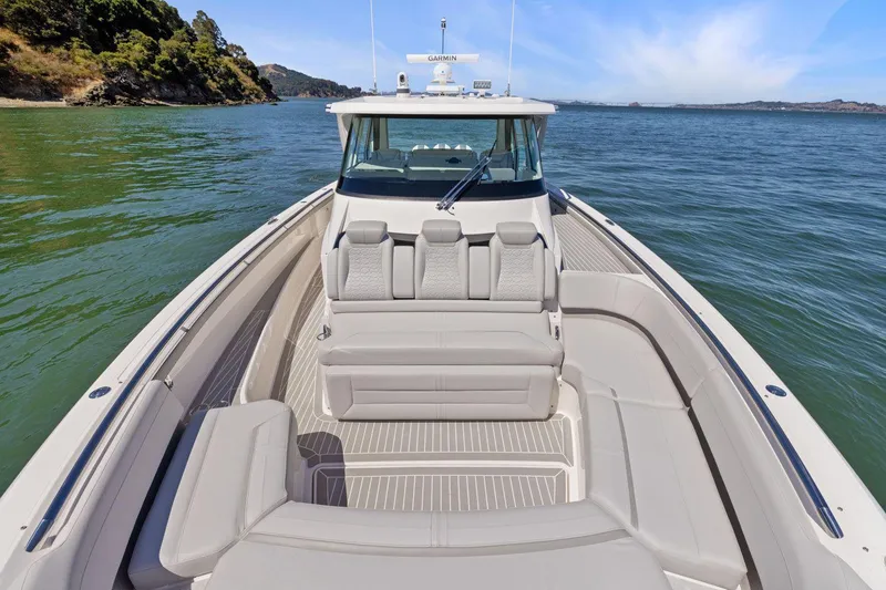 Slide: The Image of 2024 Tiara Yachts 48 LS luxury boat on calm waters. - 31