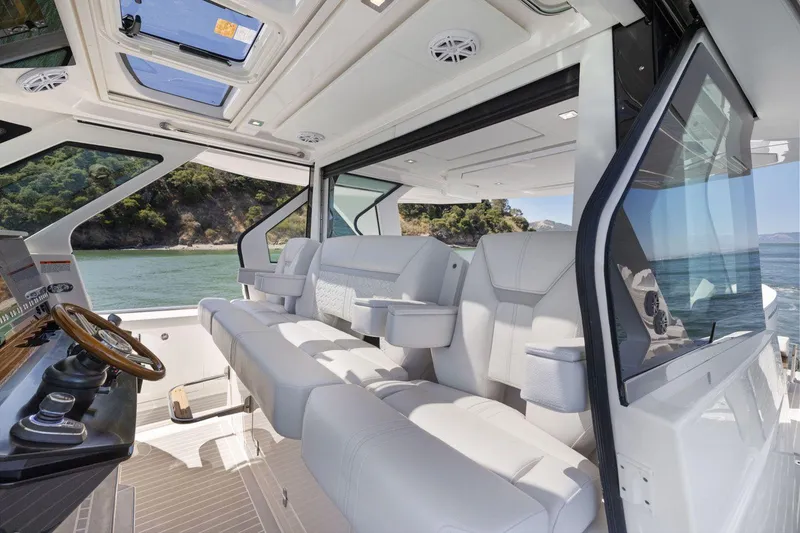 Slide: The Image of Luxurious interior of 2024 Tiara Yachts 48 LS with plush seating and scenic views. - 38