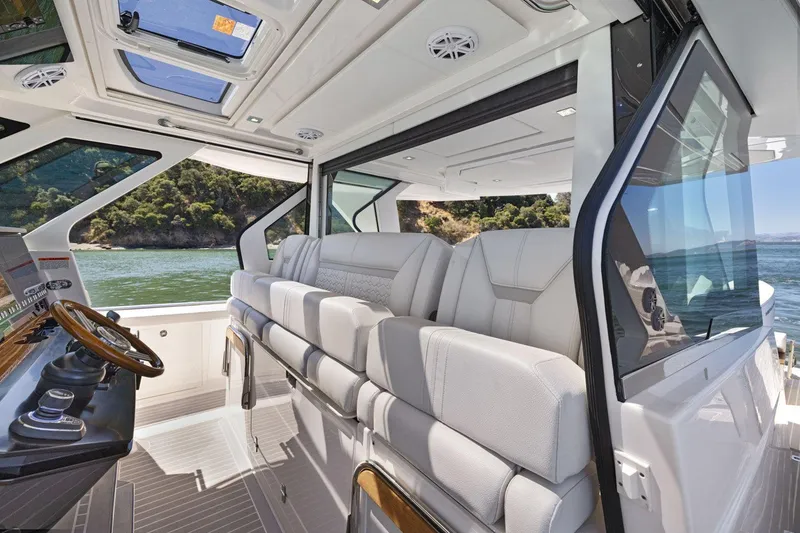 Slide: The Image of Luxurious interior of 2024 Tiara Yachts 48 LS with plush seating and scenic views. - 39
