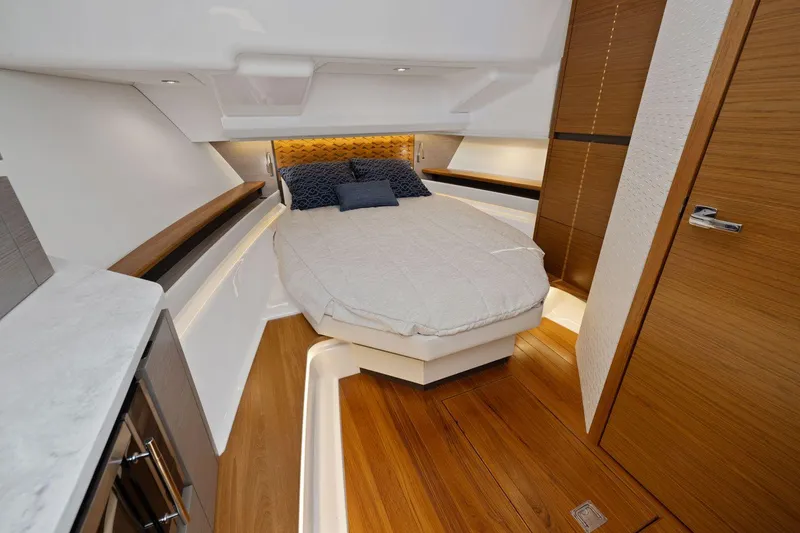 Slide: The Image of Luxurious cabin interior of 2024 Tiara Yachts 48 LS with modern design and cozy bed. - 42
