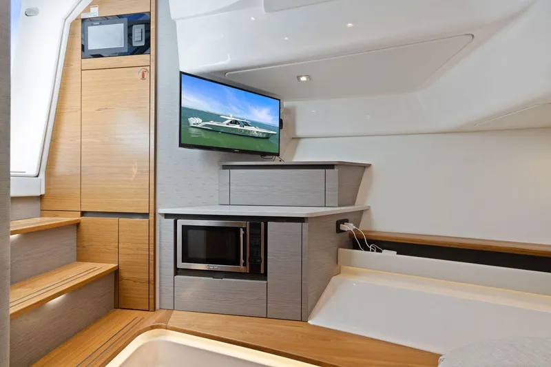 Slide: The Image of 2024 Tiara Yachts 48 LS interior with modern kitchen and entertainment area. - 43