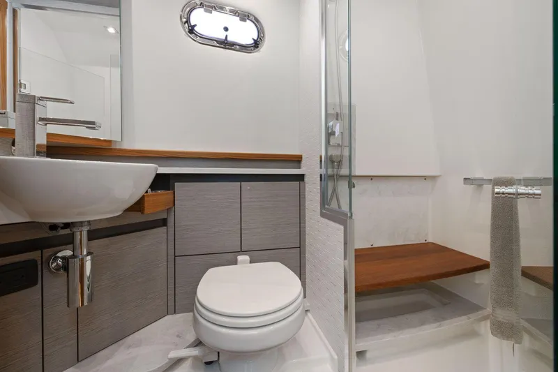 Slide: The Image of Luxurious bathroom in 2024 Tiara Yachts 48 LS, featuring modern fixtures and elegant design. - 45