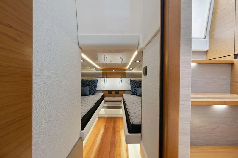 Slide: The Image of Luxurious 2024 Tiara Yachts 48 LS cabin interior with twin beds and modern design. - 47