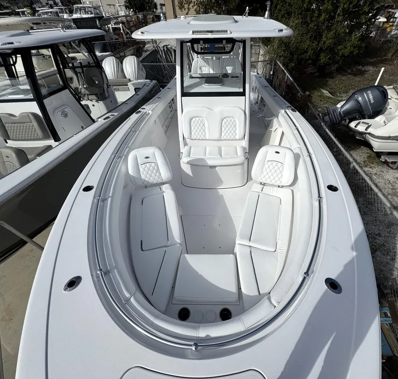 Slide: The Image of 2025 Sportsman Open 302 boat with spacious seating and modern design. - 12