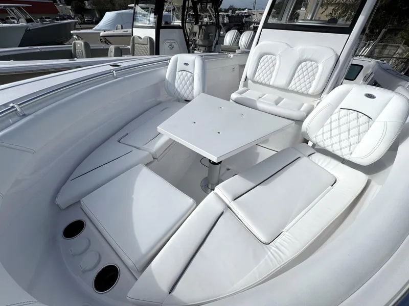 Slide: The Image of Luxurious seating area on 2025 Sportsman Open 302 boat with white upholstery. - 15