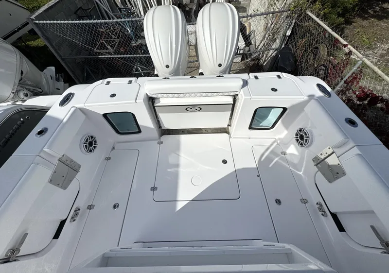 Slide: The Image of 2025 Sportsman Open 302 boat deck with dual engines, spacious layout, and modern design. - 32