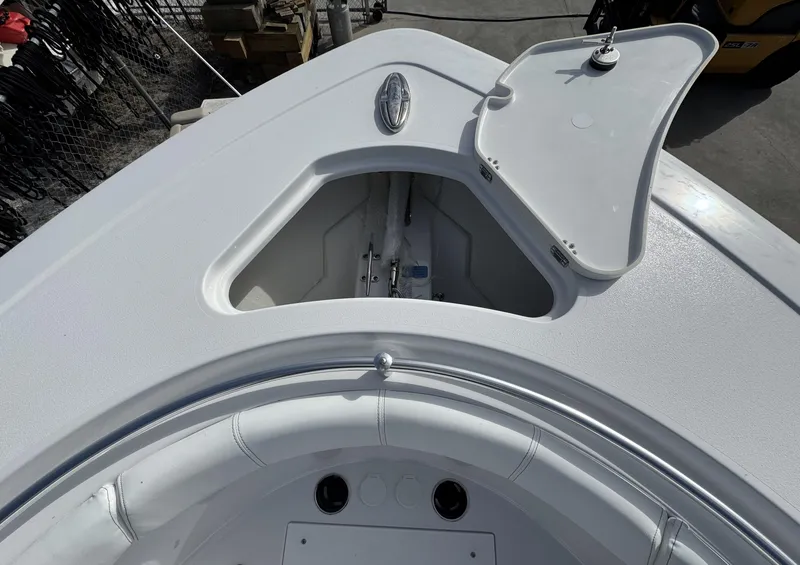 Slide: The Image of 2025 Sportsman Open 302 boat deck with open storage compartment. - 5