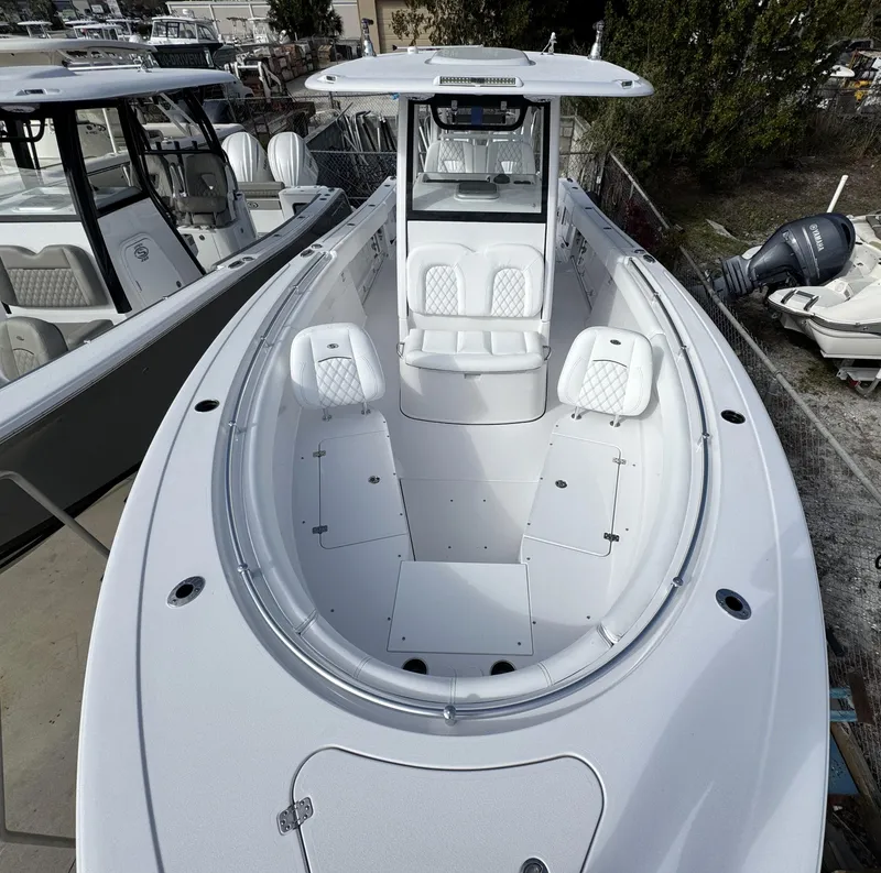 Slide: The Image of 2025 Sportsman Open 302 boat with spacious seating and modern design. - 6