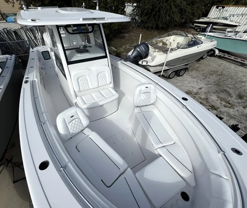Slide: The Image of 2025 Sportsman Open 302 boat with spacious seating and modern design. - 9