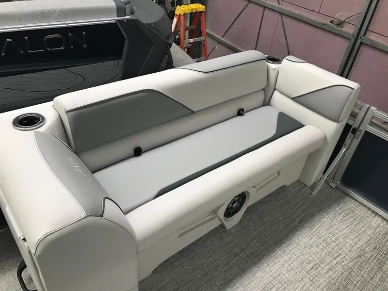 Slide: The Image of 2025 Avalon Venture Cruise Rear Bench, 22-foot, featuring sleek gray and white upholstery. - 10