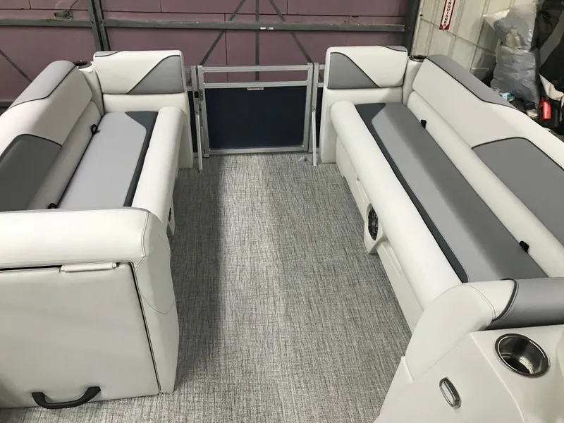 Slide: The Image of 2025 Avalon Venture Cruise Rear Bench, 22-foot pontoon boat interior with gray and white seating. - 12