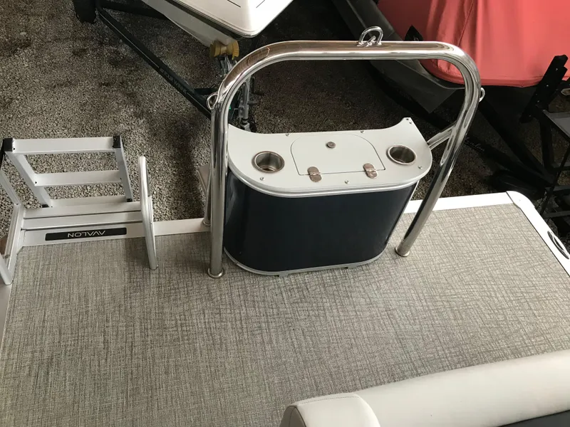 Slide: The Image of 2025 Avalon Venture Cruise Rear Bench with ladder and railing on deck. - 24