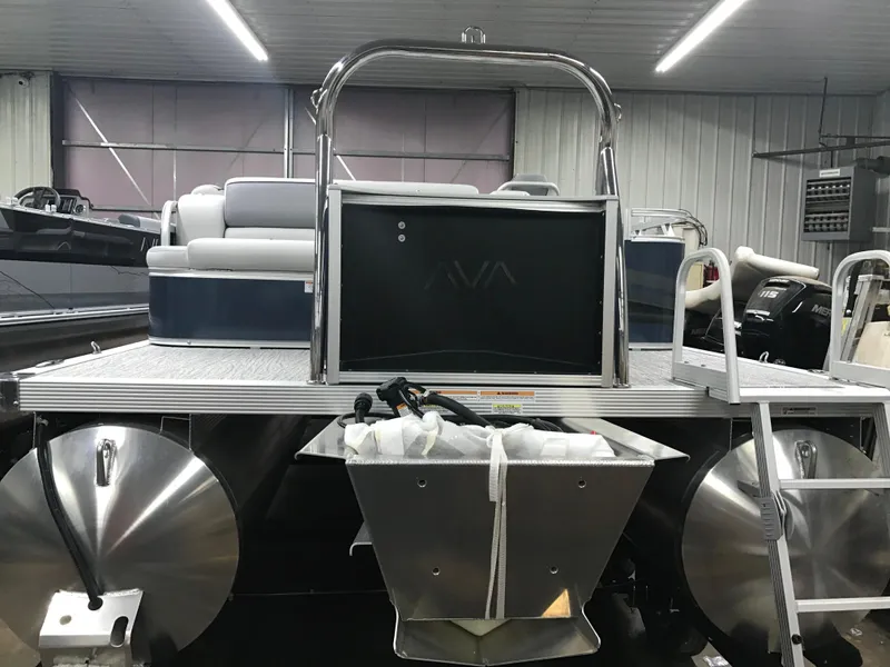 Slide: The Image of 2025 Avalon Venture Cruise Rear Bench pontoon boat in showroom, rear view. - 7