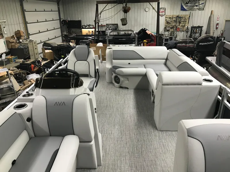 Slide: The Image of 2025 Avalon Venture Cruise Rear Bench boat interior in a workshop setting. - 9