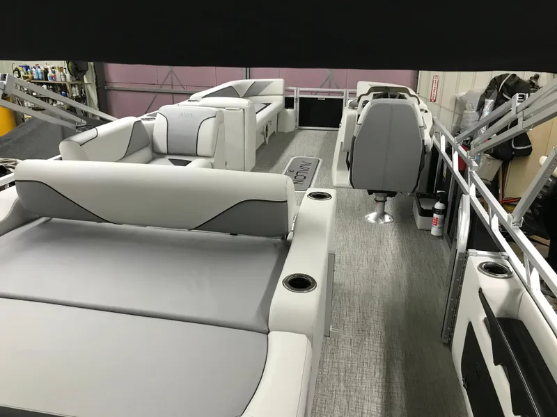 Slide: The Image of 2025 Avalon VENTURE 2585 VERSATILE REAR BENCH pontoon boat in a garage setting. - 12
