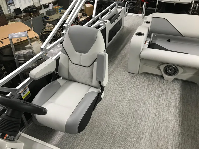 Slide: The Image of 2025 Avalon VENTURE 2585 VERSATILE REAR BENCH interior with gray seating and steering. - 23
