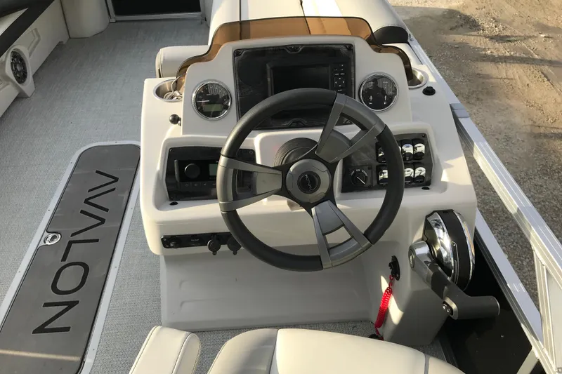 Slide: The Image of 2025 Avalon VENTURE 2585 VERSATILE REAR BENCH boat dashboard with steering wheel and controls. - 30