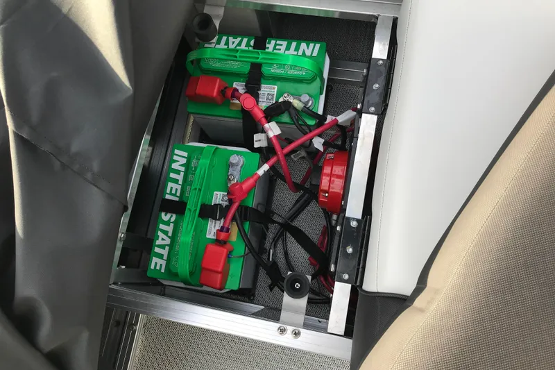Slide: The Image of Battery compartment of 2025 Avalon VENTURE 2585 VERSATILE REAR BENCH with Interstate batteries. - 37