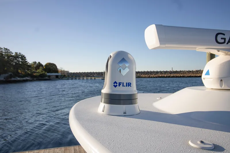 Slide: The Image of 2024 Yellowfin 39 boat with FLIR camera on deck, near water. - 10