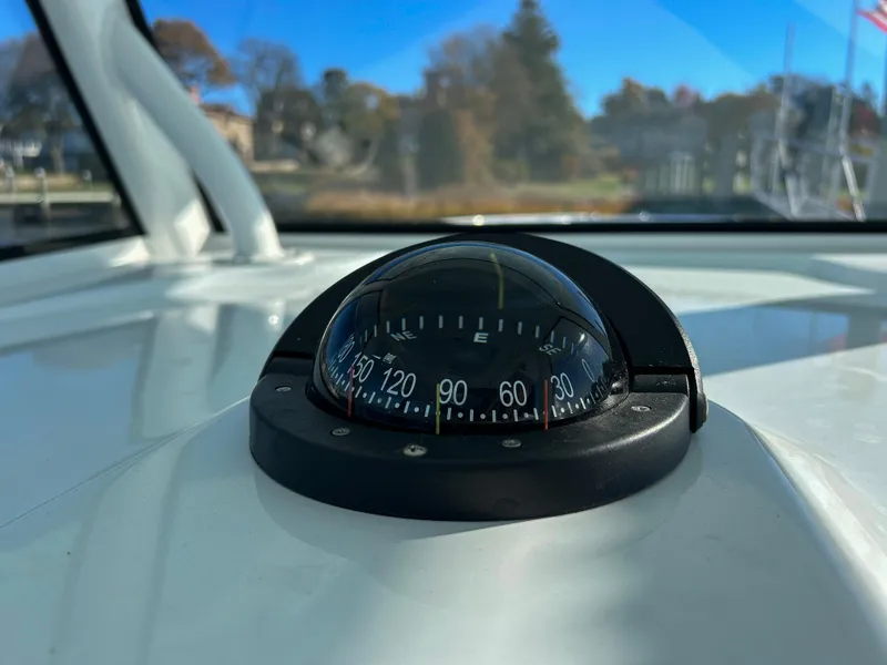 Slide: The Image of Compass on 2024 Yellowfin 39 boat dashboard, clear sky background. - 11