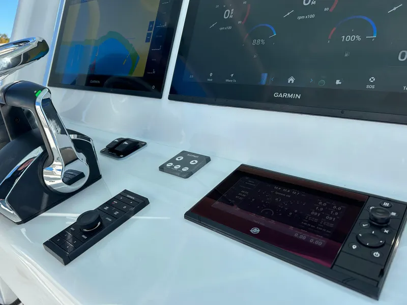 Slide: The Image of 2024 Yellowfin 39 boat dashboard with Garmin navigation system and controls. - 13