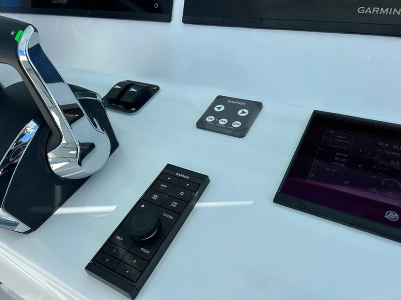 Slide: The Image of 2024 Yellowfin 39 boat control panel with advanced navigation technology. - 14