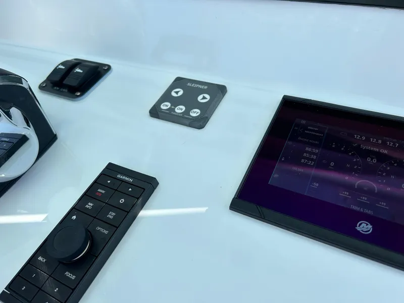 Slide: The Image of 2024 Yellowfin 39 boat dashboard with modern controls and display screen. - 15