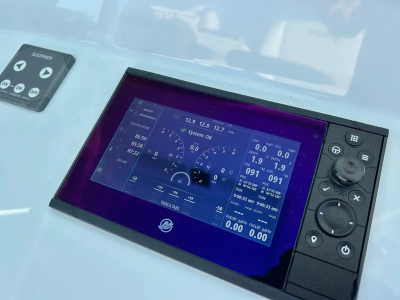Slide: The Image of 2024 Yellowfin 39 boat dashboard with digital display and control panel. - 16